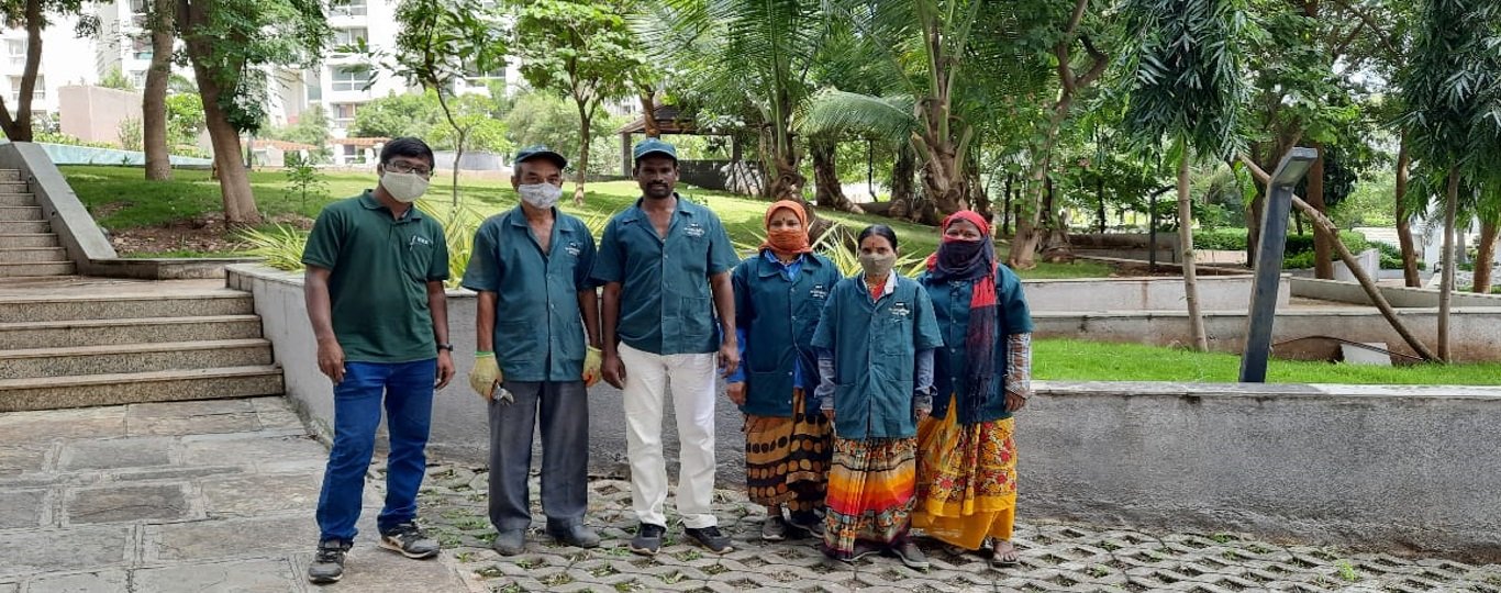 Nice Gardening Services team working on a garden in Pune